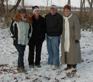 Heather Harwood, Wawasee Area Conservancy Foundation; Syracuse-Wawasee Trails Executive Director Megan McClellan; Sam Leman, WACF Chairman; and Kay Young, Wawasee Property Owners Association President , are shown on the site of a trail to be installed on WACF property. (Photo by Chelsea Los & courtesy of  Ink Free News )